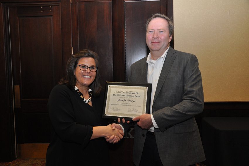 Jennier Doerge, winner of a Staff Excellence Award in the exempt category, with Dean Larry Holloway