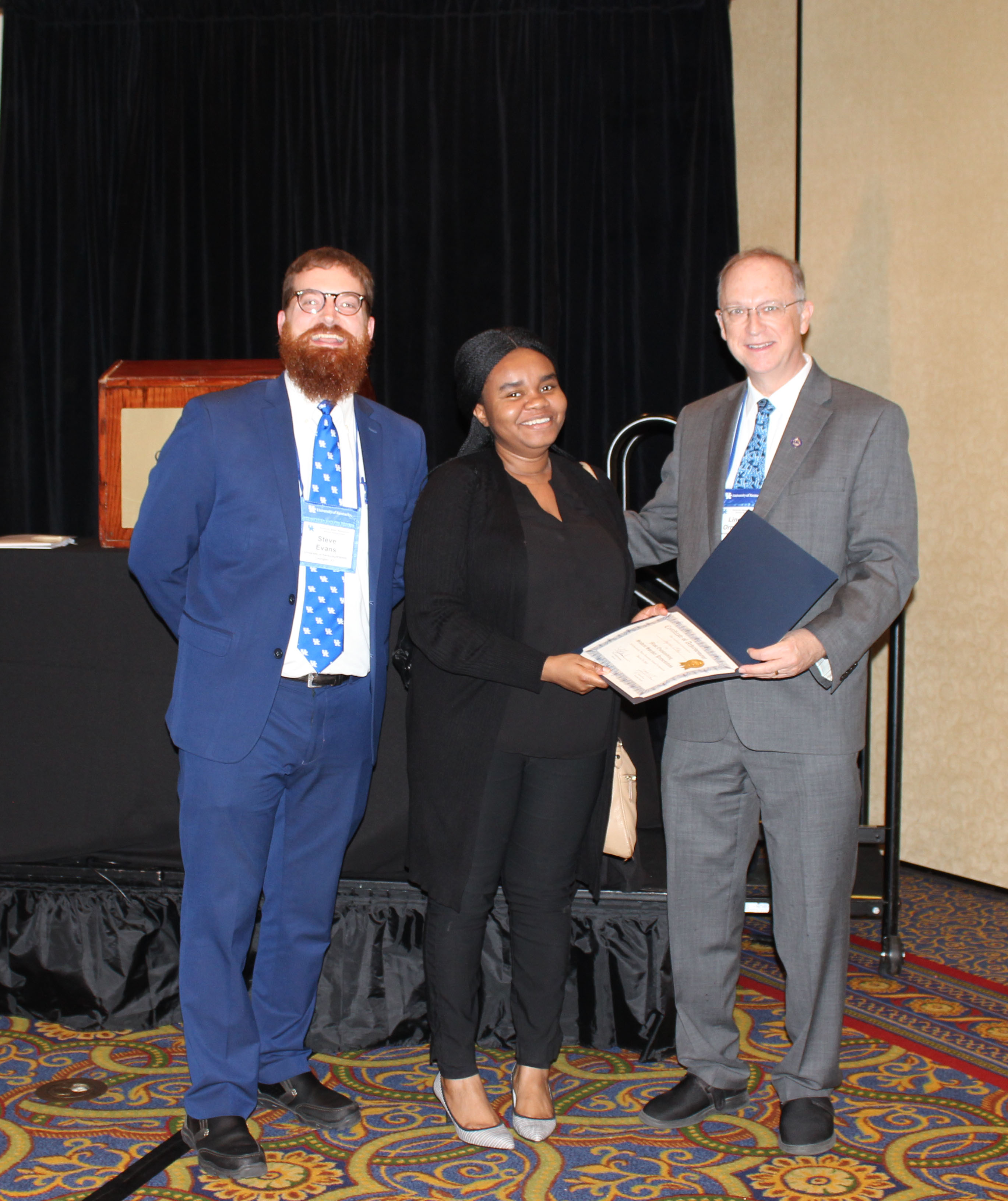 Joyner Eke receiving the “Most Outstanding Student Speaker Presentation” award. 