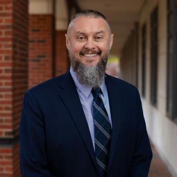 Professional headshot of Tim RB Taylor.